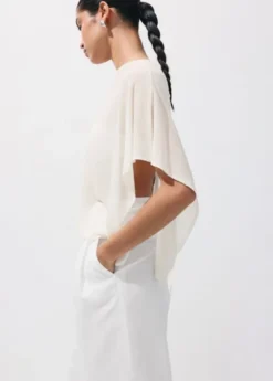 Asymmetrical knitted cape